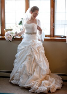 Megan’s ballgown featured a form-fitting, ruched bodice, a sparling belt and a floral-embellished skirt.  