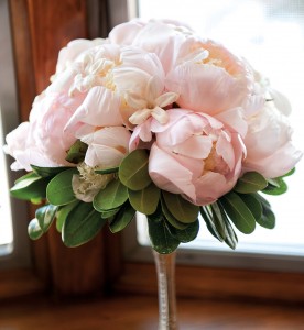 Megan and her sister carried similar bouquets composed of blush-hued peonies.