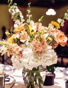 The salmon-and- white color scheme echoed floral arrangements.