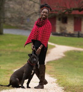 Hawa’s reversible black/red cape and infinity scarf are from Festoon.