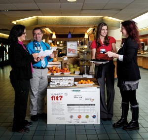 A display in the hospital’s dining area is dedicated to the super foods we read about but rarely get to taste. Samples are shared through the displays that change on a monthly basis, as are recipes and other information. January’s super foods display focused on citrus. Here, Brynn Kline (in red) shares samples with Alicia Mulcavage, while Dr. Christian Hermansen, MD, and Yvette Soulidis study the recipe handouts that are made available. “It’s definitely a learning process,” says Brynn.