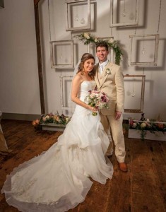 The backdrop for Briana and Justin’s ceremony at the Union Meeting House in Marietta was created by her father, Roger Webster, and Justin’s stepfather, Lenny Droege. Justin discovered the window frames in his grandfather’s barn. Old-style tool boxes (one an original, the other a replica) were used to contain flowers. Photography by Bill Hunking.