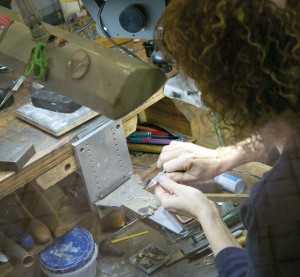 Koser Jewelers head goldsmith Beth de Vitry hand fabricates a custom necklace that was being presented as a gift.