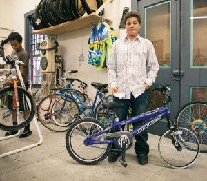 Older kids (12-17) can spend the summer learning the nuts and bolts of bikes through The Common Wheel. At the end of the session, a participant leaves with a lock, helmet and bike. Photo courtesy of The Common Wheel.