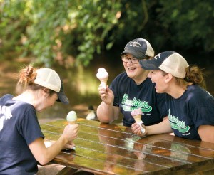 Employees enjoy an ice cream break at one of the picnic tables that offers a view of Little Muddy Creek.