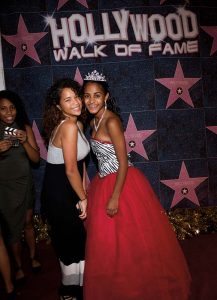 Diandra and a guest pose on the red carpet that was part of the “Hollywood” theme of the party. The red and black in the color scheme pay homage to the colors of Hempfield High School, where Diandra is a student.