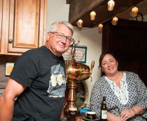  Kurt and Tracy Fichthorn are having fun with the beer kitchen that Kurt long dreamed of installing in the lower level of their home. Between them is a copper/brass keg that friends brought home from Spain and, knowing Kurt would put it to good use, they gave it to the Fichthorns. 