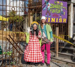 Annette Schopf (left) has played numerous roles at Field of Screams over the years. Here, she and Daisy Wright prepare to distribute medals to finishers in the annual 5K Zombie Run that is held in November and benefits the Pennsylvania Breast Cancer Coalition. 