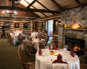 The iconic exposed log construction sets the tone in many of the ground-floor dining rooms. 