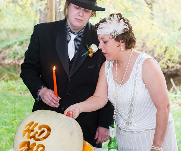 Heidi and Matt lit a monogrammed unity pumpkin.