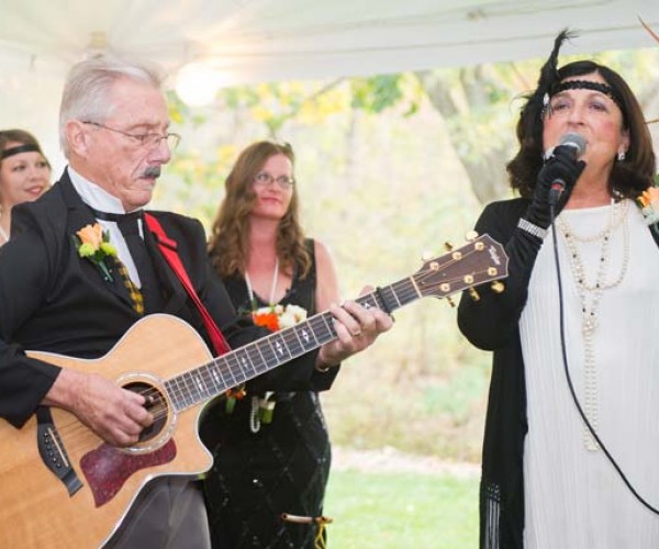 The bride’s father provided accompaniment for Mary Ann Garrett’s rendition of The Wedding Song.