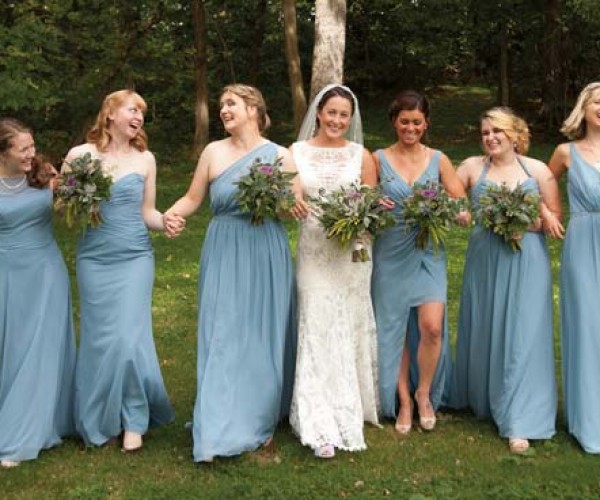 Lauren’s attendants wore various styles of dresses that were unified by the color “Once Upon a Time” blue.