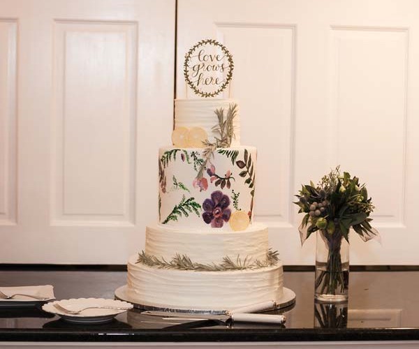 The cake, with its hand-painted flowers, also alluded to gardening/farming.