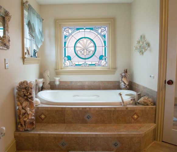 Andrea designed the stained glass window and worked with a glass artist to bring it to life.