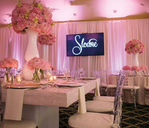 Bent Creek’s ballroom was totally transformed with blush-pink fabric, specialty lighting, dramatic coordinating floral arrangements and chic décor.