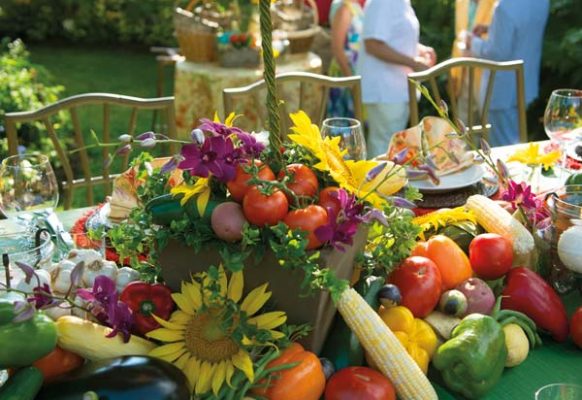 The dinner table was laden with vegetables, flowers and topiaries. At the end of the evening, guests were provided with baskets they could fill with the vegetables from the table.