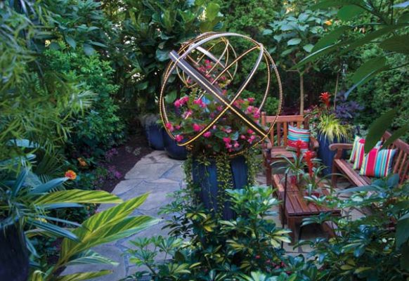 One of the property’s secret gardens is illuminated by metal spheres that Tim designed.