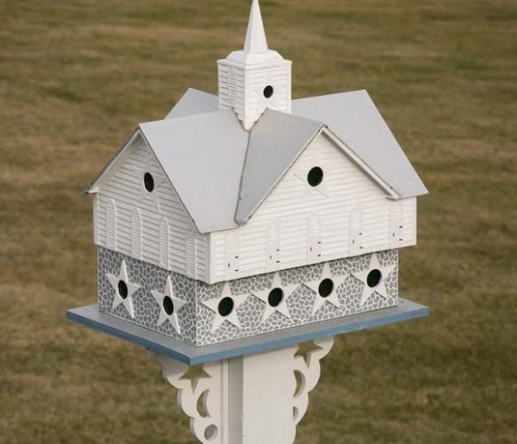 Larry’s Star Barn birdhouse was designed with purple martins in mind. Popsicle sticks are among the building materials Larry uses to construct the birdhouses.